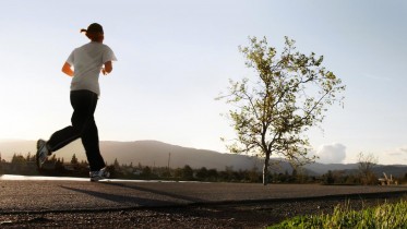 Woman-Running-Road-Outside-Fitness